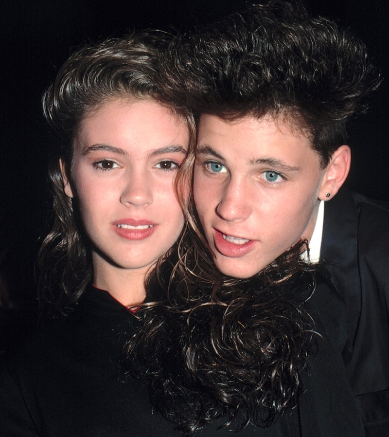 Alyssa Milano and Corey Haim | Getty Images Photo by Walter McBride/Corbis